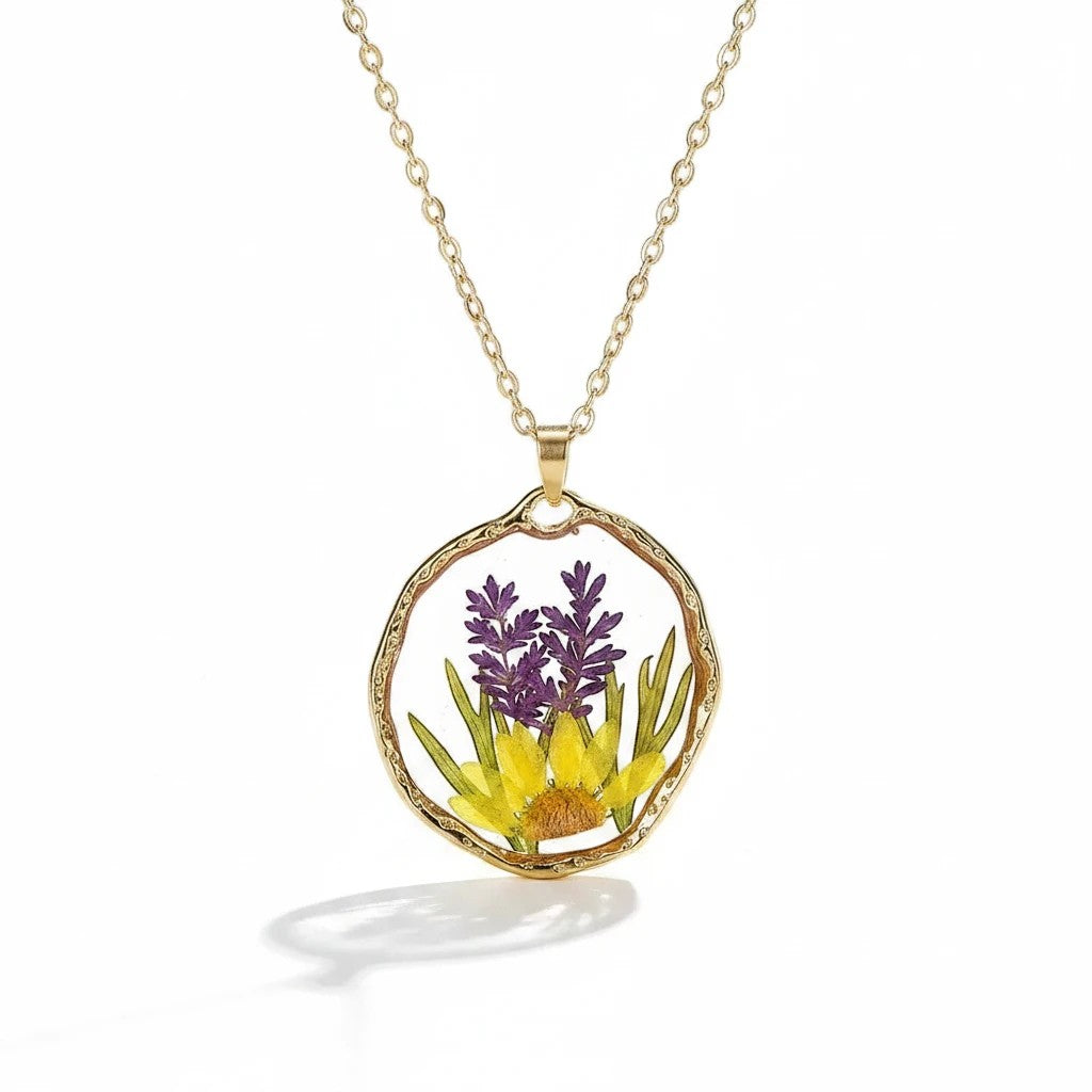 Alyssa's House round pendant necklace featuring real preserved lavender and yellow flowers in resin on a gold chain.