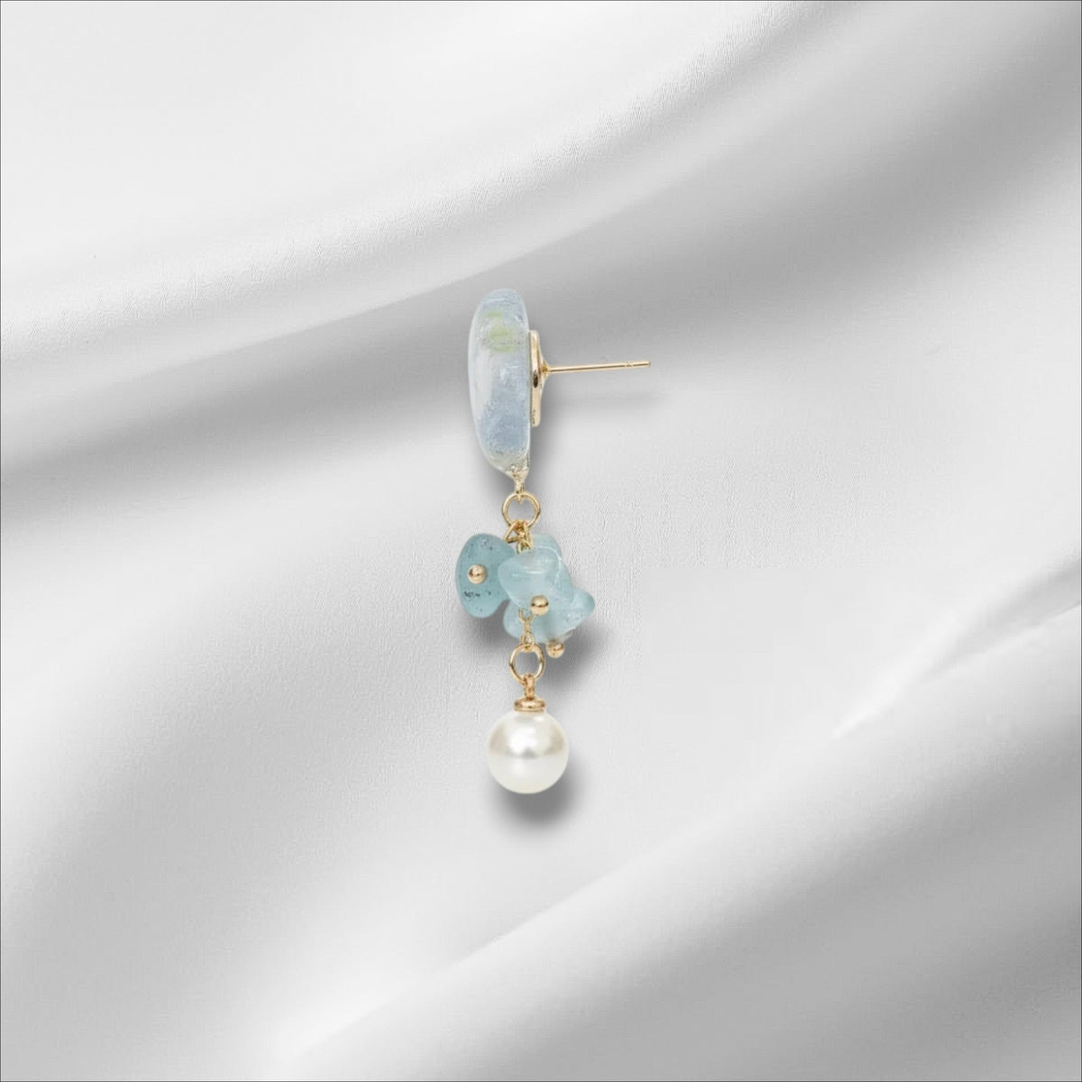 Alyssa's House blue floral square resin drop earrings with stone chips and a pearl accent on a white background.