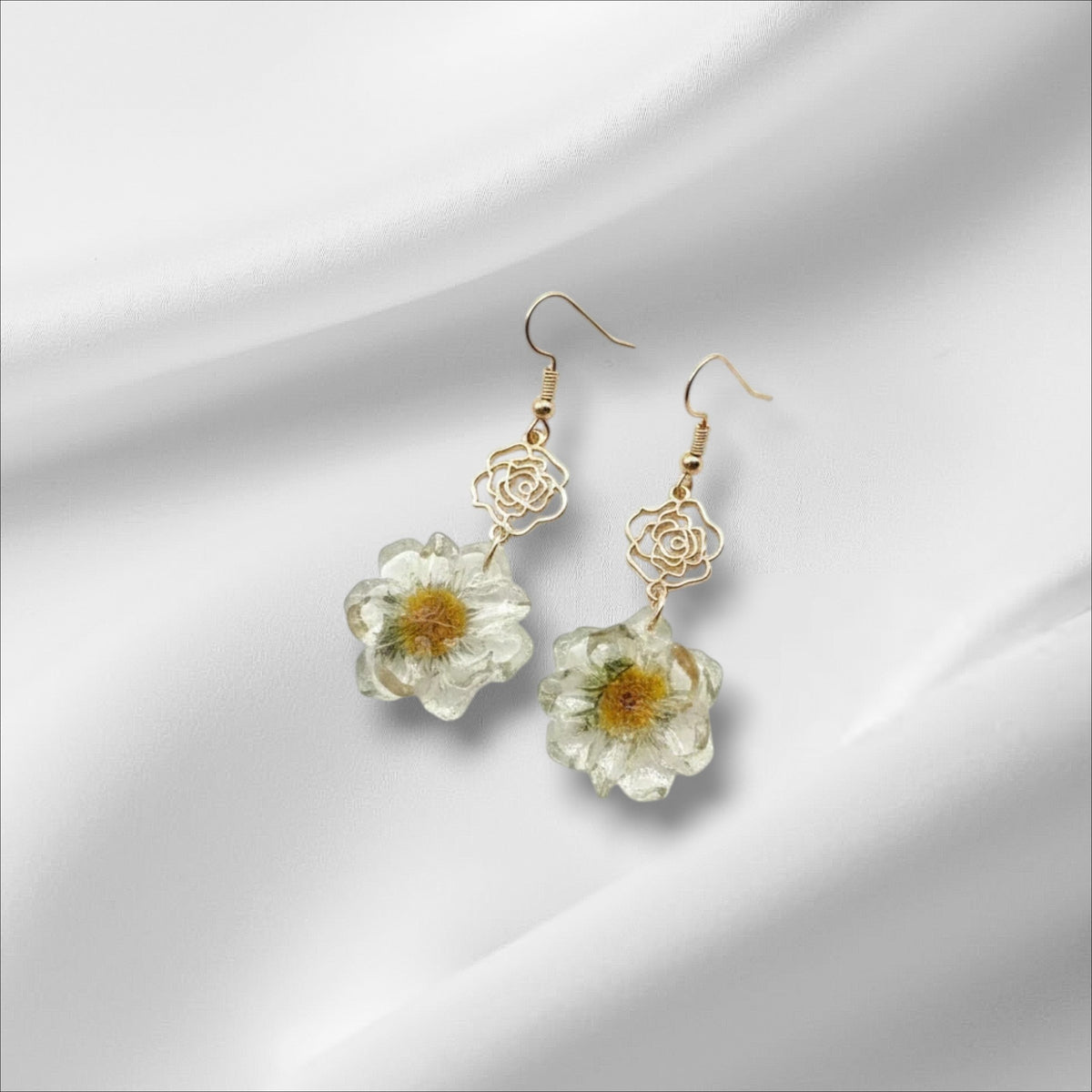 Alyssa's House cream rose drop earrings with gold-tone chain and delicate floral resin charms.