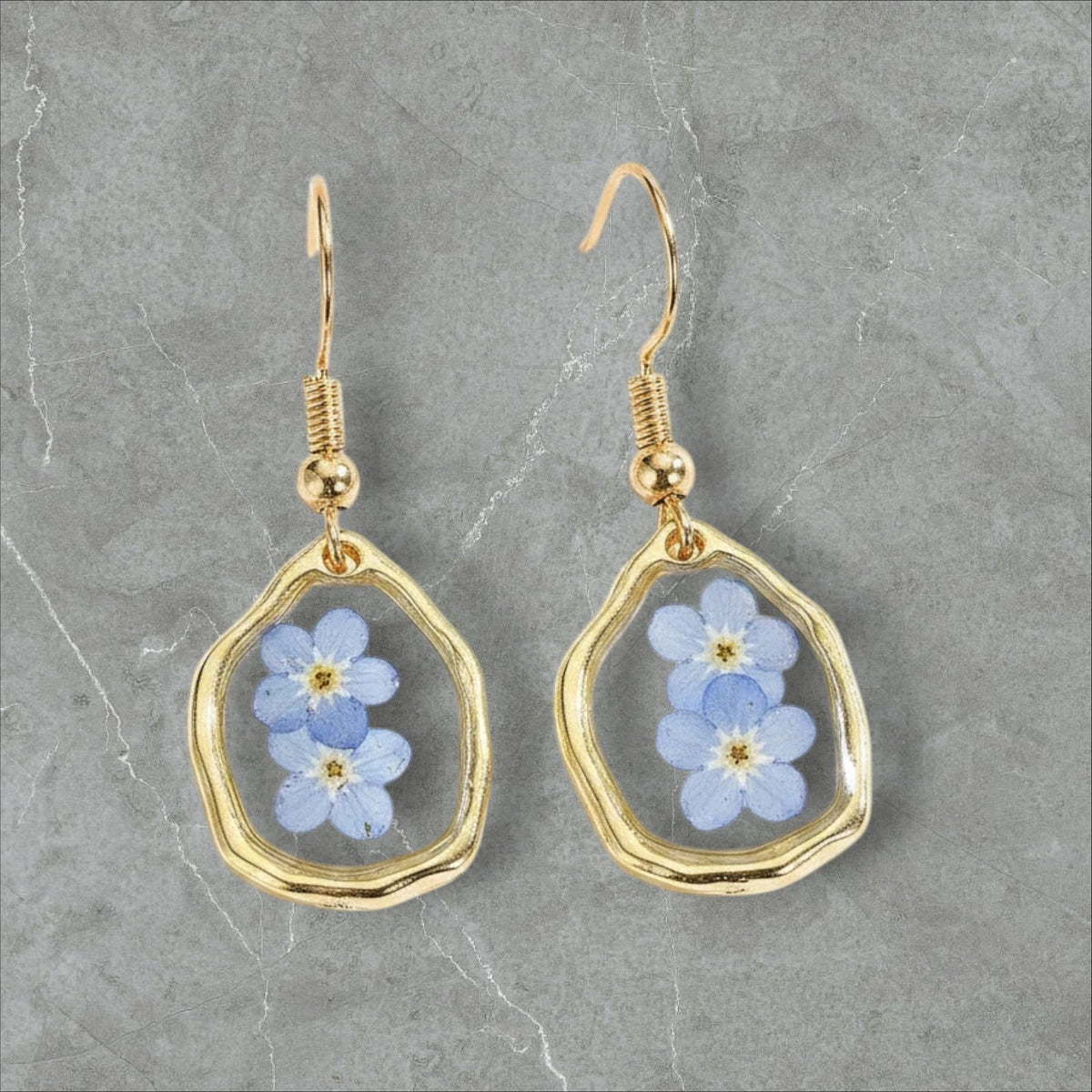 Alyssa's House oval resin earrings featuring blue forget-me-not flowers in a gold-tone frame for everyday wear.
